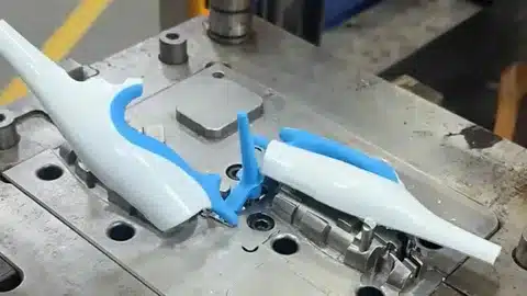 Silicone overmolding process with plastic insert in custom mold