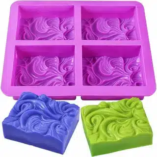 Custom silicone soap mold with decorative swirl pattern cavities for handmade soap production