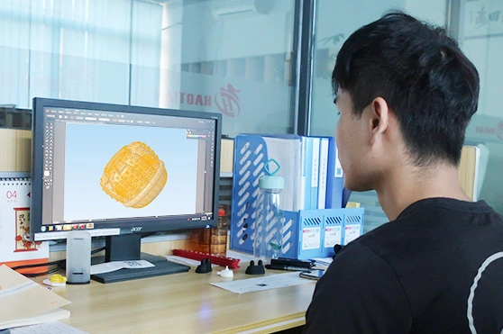 Engineer creating a 3D design for a custom silicone pet product on a computer