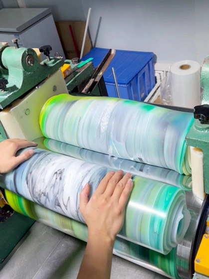 Silicone sheet material being processed into rolls for different custom part applications