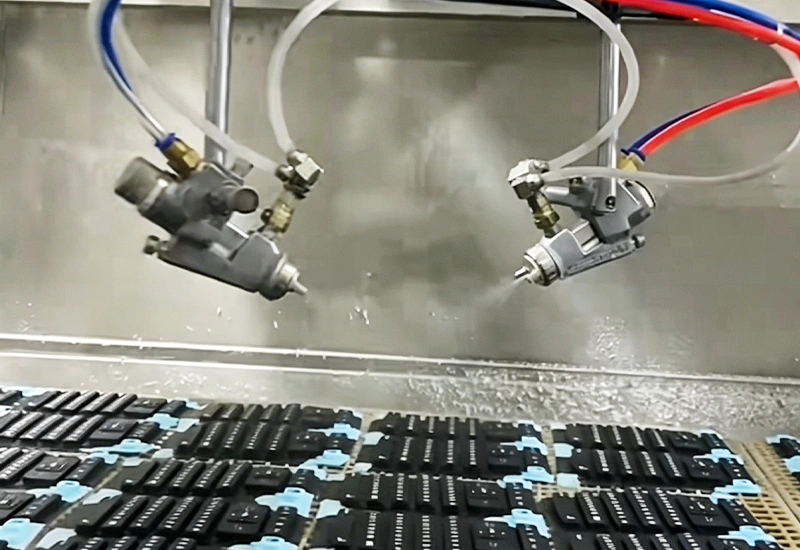 Automatic spray coating process applying oil finish and surface treatment to silicone products