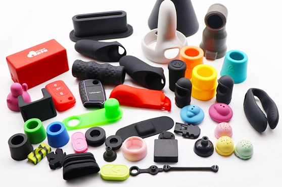Various specialty silicone components including grips, covers, buttons, and custom molded parts