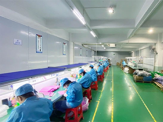 HT Silicone quality inspection line and workers checking custom silicone products in a cleanroom
