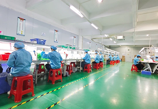 Workers assembling silicone products in factory assembly workshop