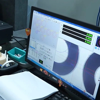 Engineers reviewing silicone product design using CAD software for precision manufacturing