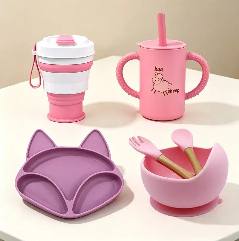 Custom silicone drinkware and children's tableware including collapsible cups, sippy cups, divided plates, and feeding bowls