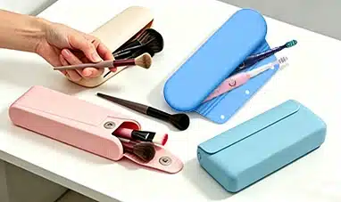 Pink, blue, and beige magnetic closure silicone makeup bags with compartments for brushes and cosmetics