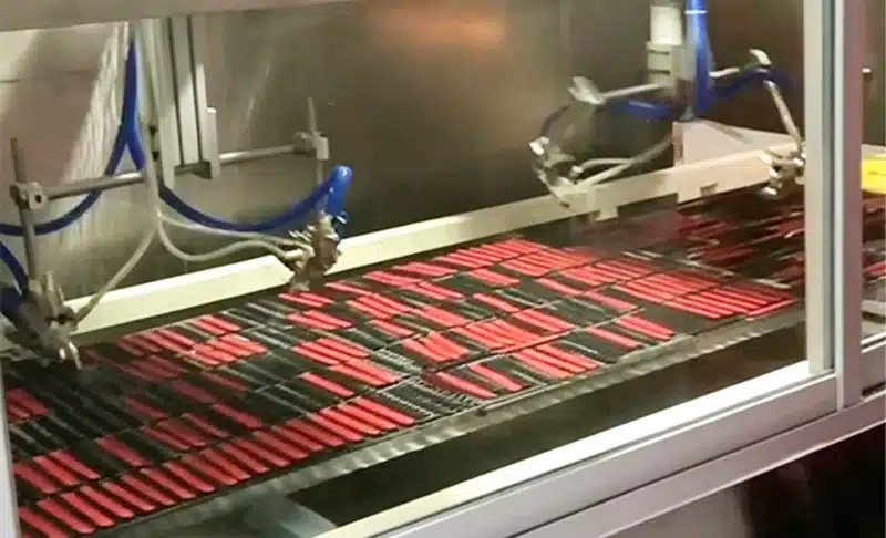 Spray coating process for custom silicone products to add color or protective layers