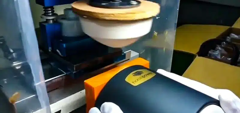 Explanation of silicone pad printing process, showing setup, artwork transfer, and product finishing.